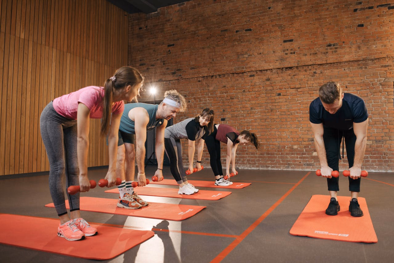 People Practicing Yoga Inside the Studio